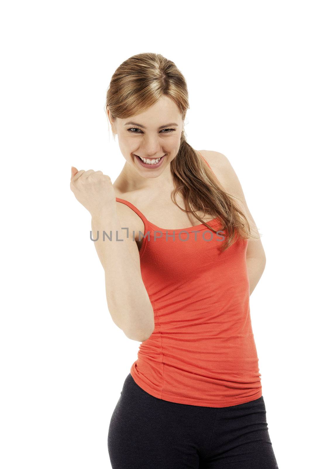 successful blonde happy fitness woman showing her fist on white background