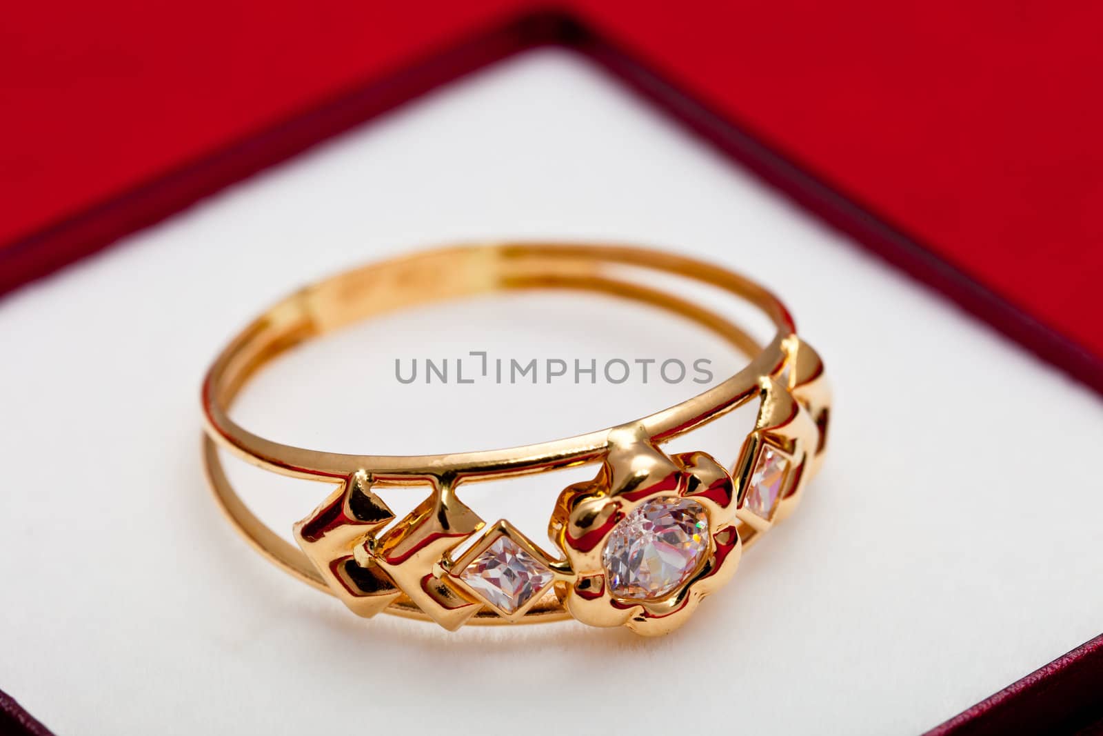 Fantastic gold ring adorned with several white zirconia