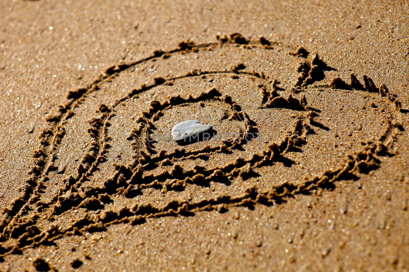 Hearts drawn out on a sandy beach