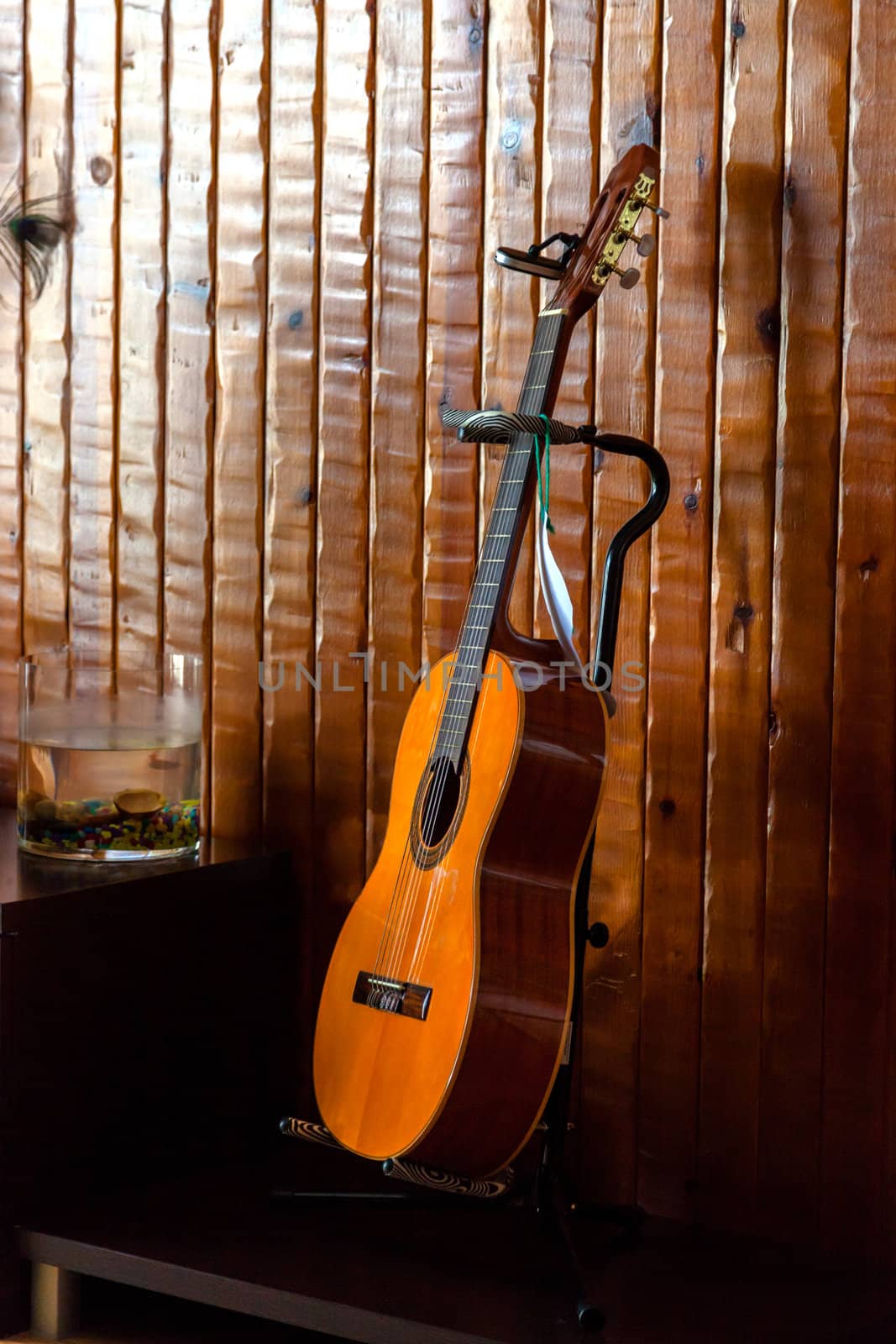 Classic spanish guitar  near of a wood wall