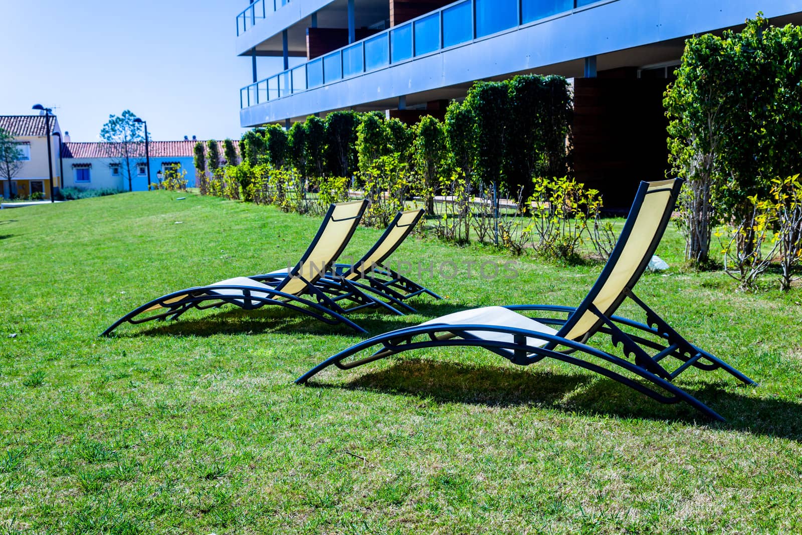 Several deckchairs near the swimming pool