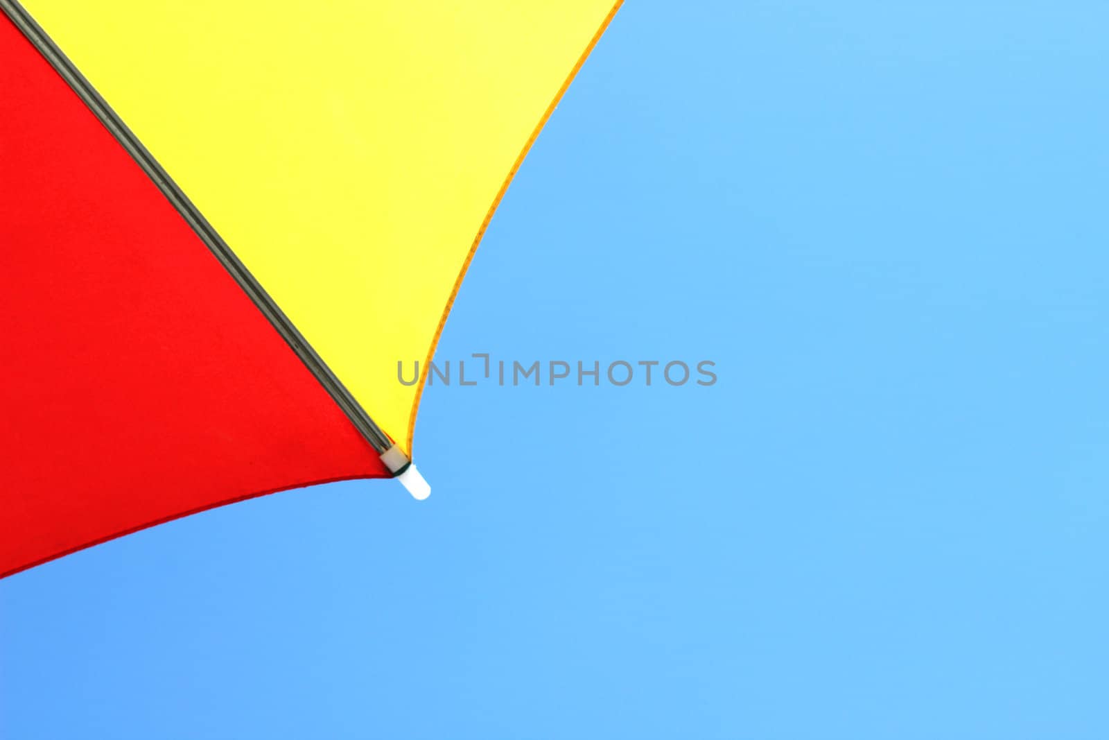 cropped umbrella close up in blue sky background