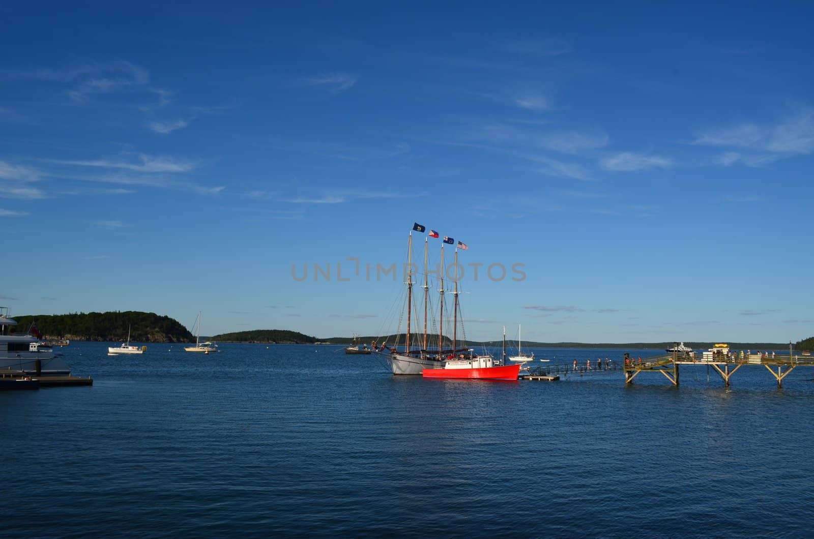 A big four mast ship docked at Bar Harbor in Maine