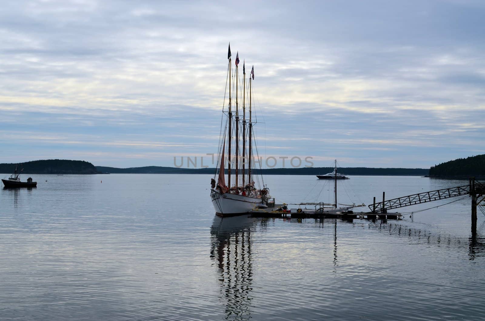 A ship at dock on a warm morning