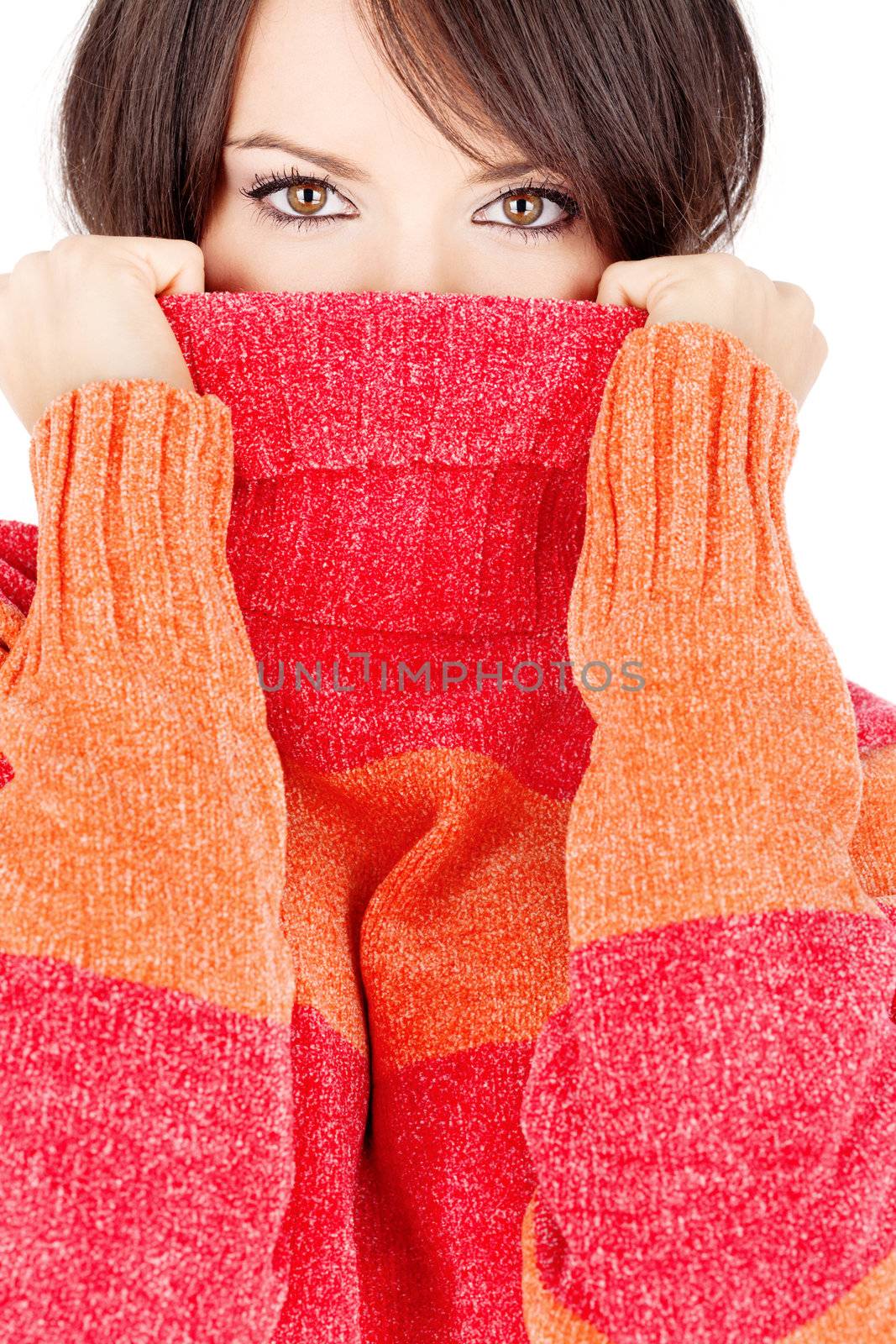 pretty eyes of a brunette woman in wool sweater, isolated on white background