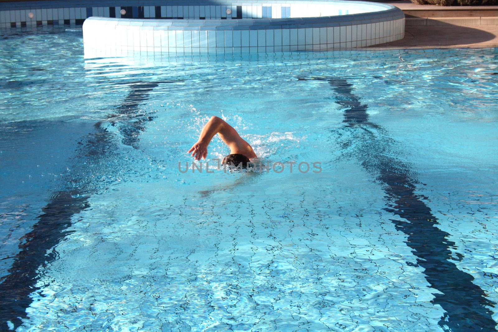 swim the crawl in swimming pool by photochecker