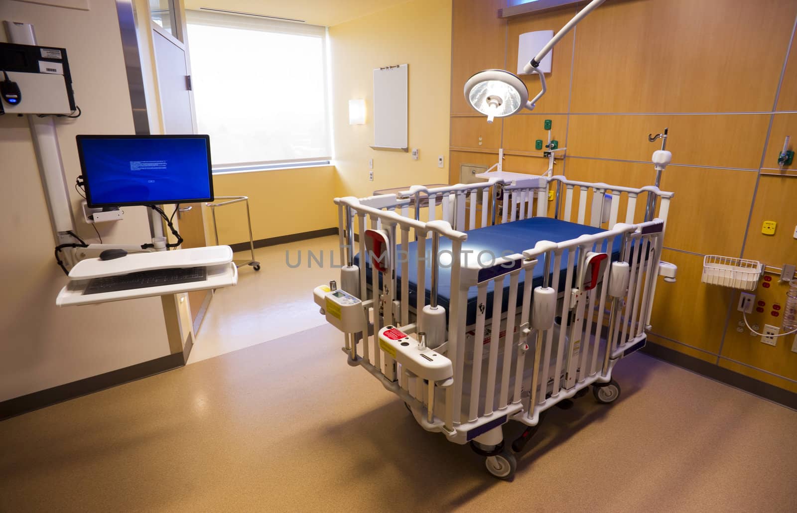 Medical Inspection Light Shines Down Bed Childrens Hospital Room by ChrisBoswell