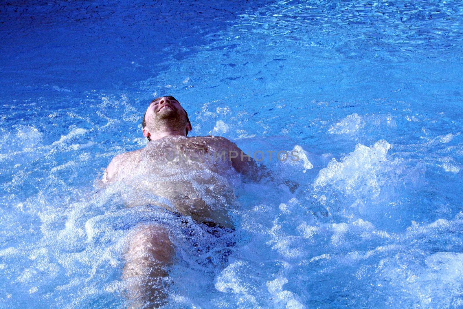 young attractive man relax in spa area