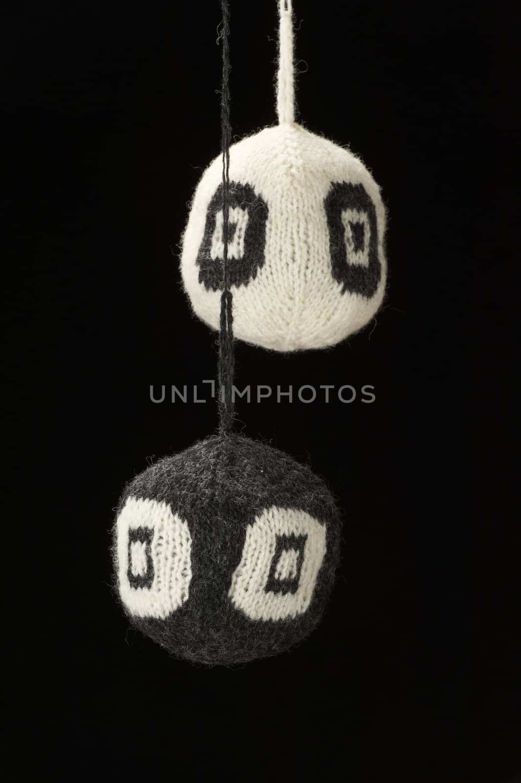 Knitted balls - on black background