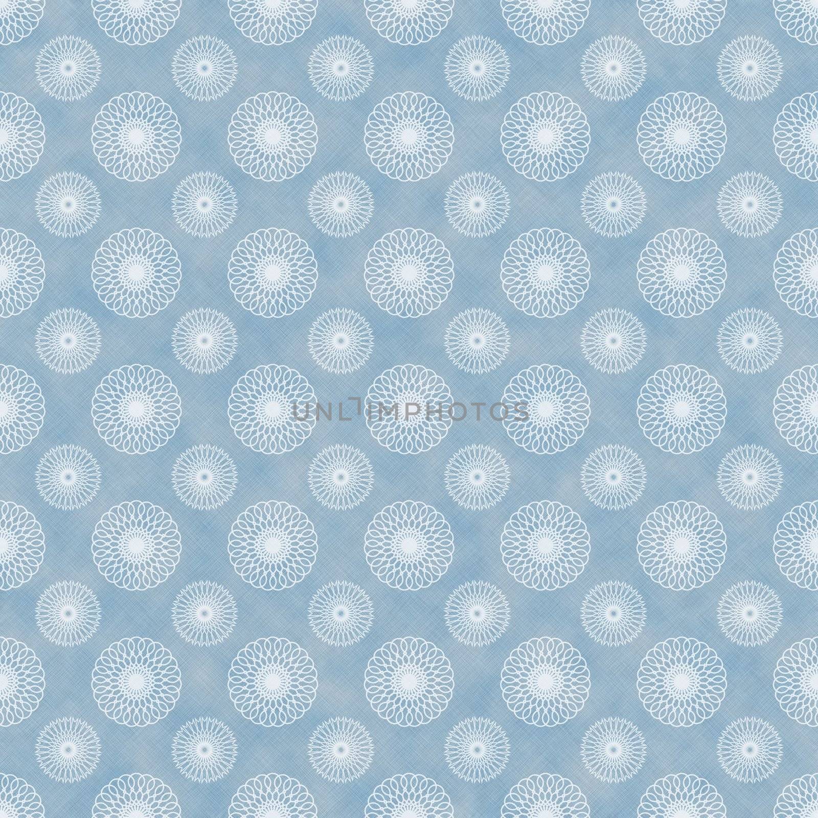 White kaleidoscope spirals on faded blue denim chambray fabric