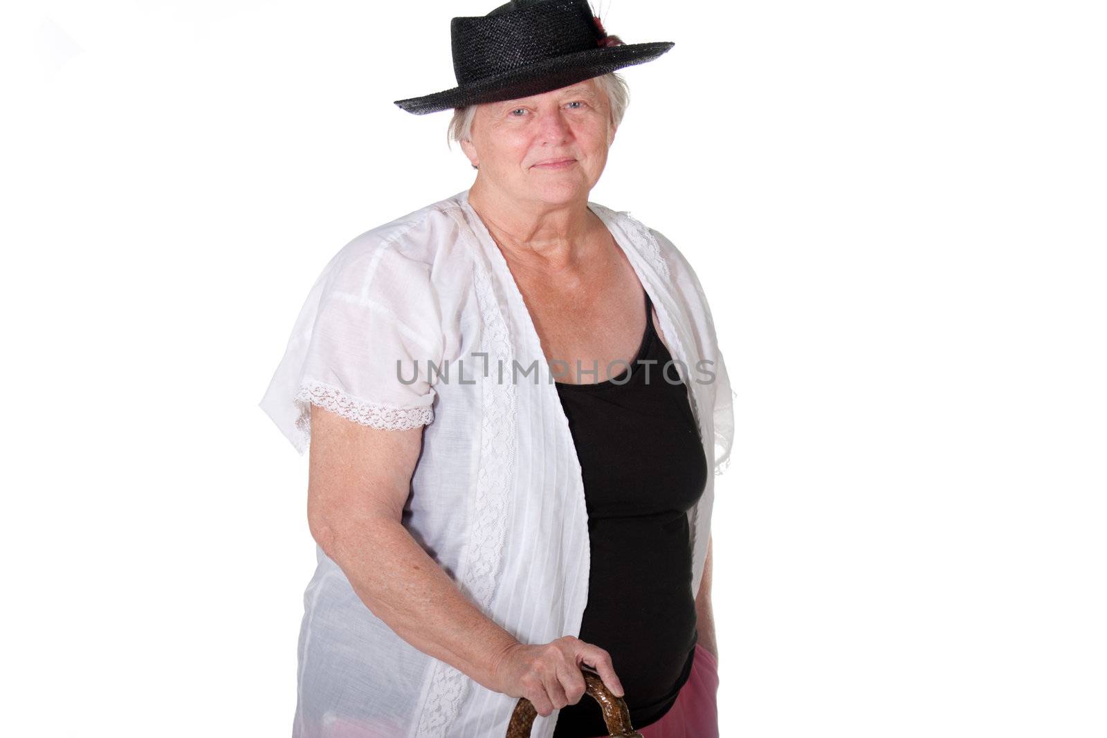 Senior woman with cane and hat smiling