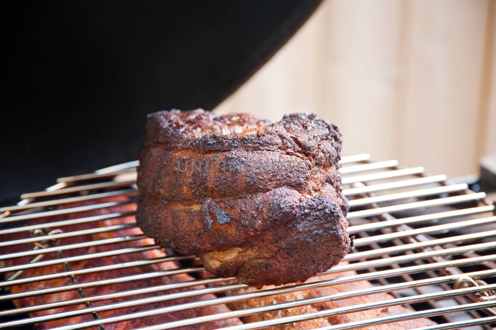 Pork shoulder on a grill