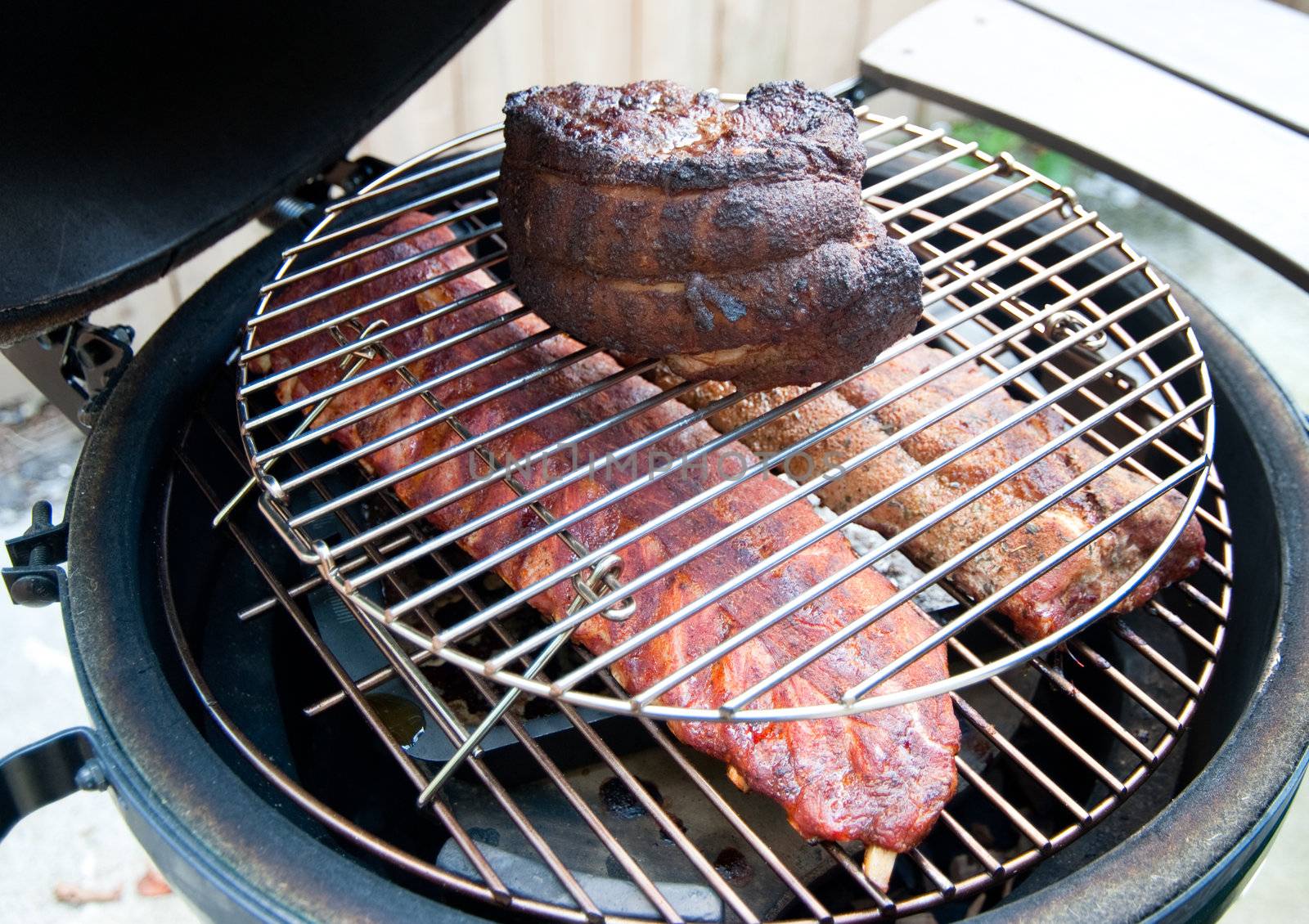 Pork shoulder and ribs on a grill