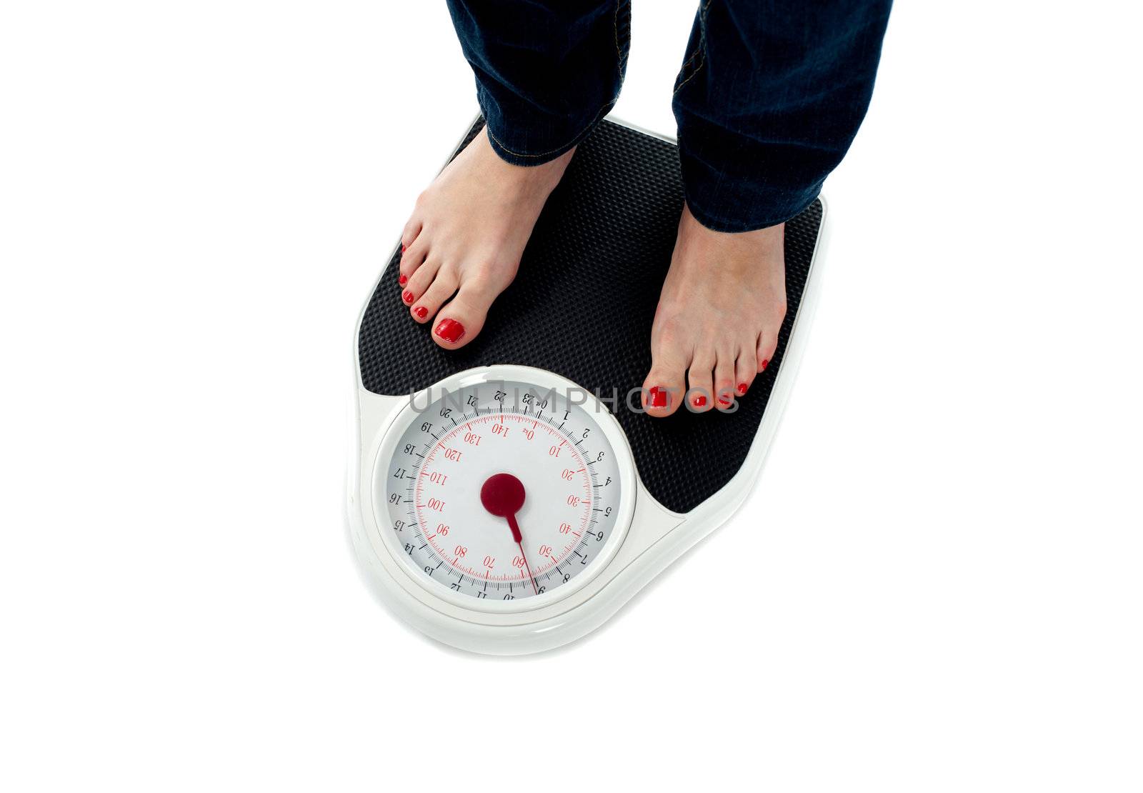 Woman standing on weighing scale, closeup of legs. All on white background