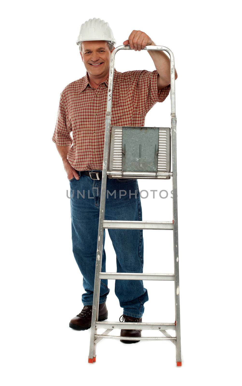 Full length portrait of smiling construction worker holding ladder