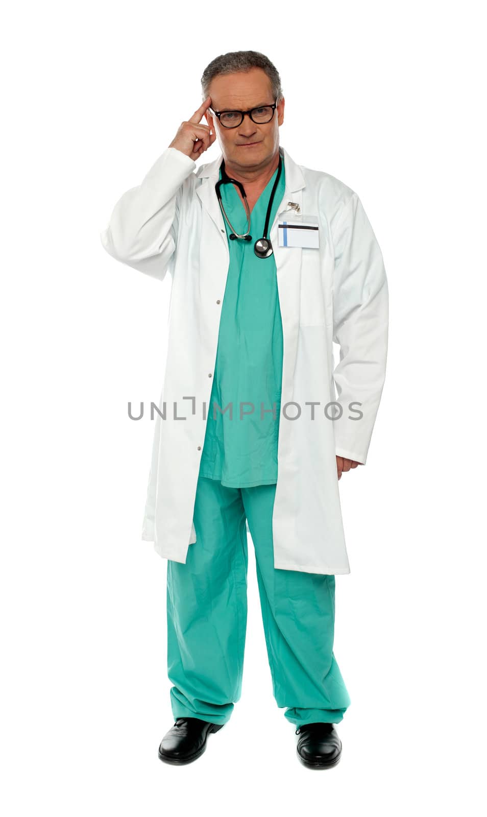 Portrait of thoughtful senior doctor posing with finger on his head