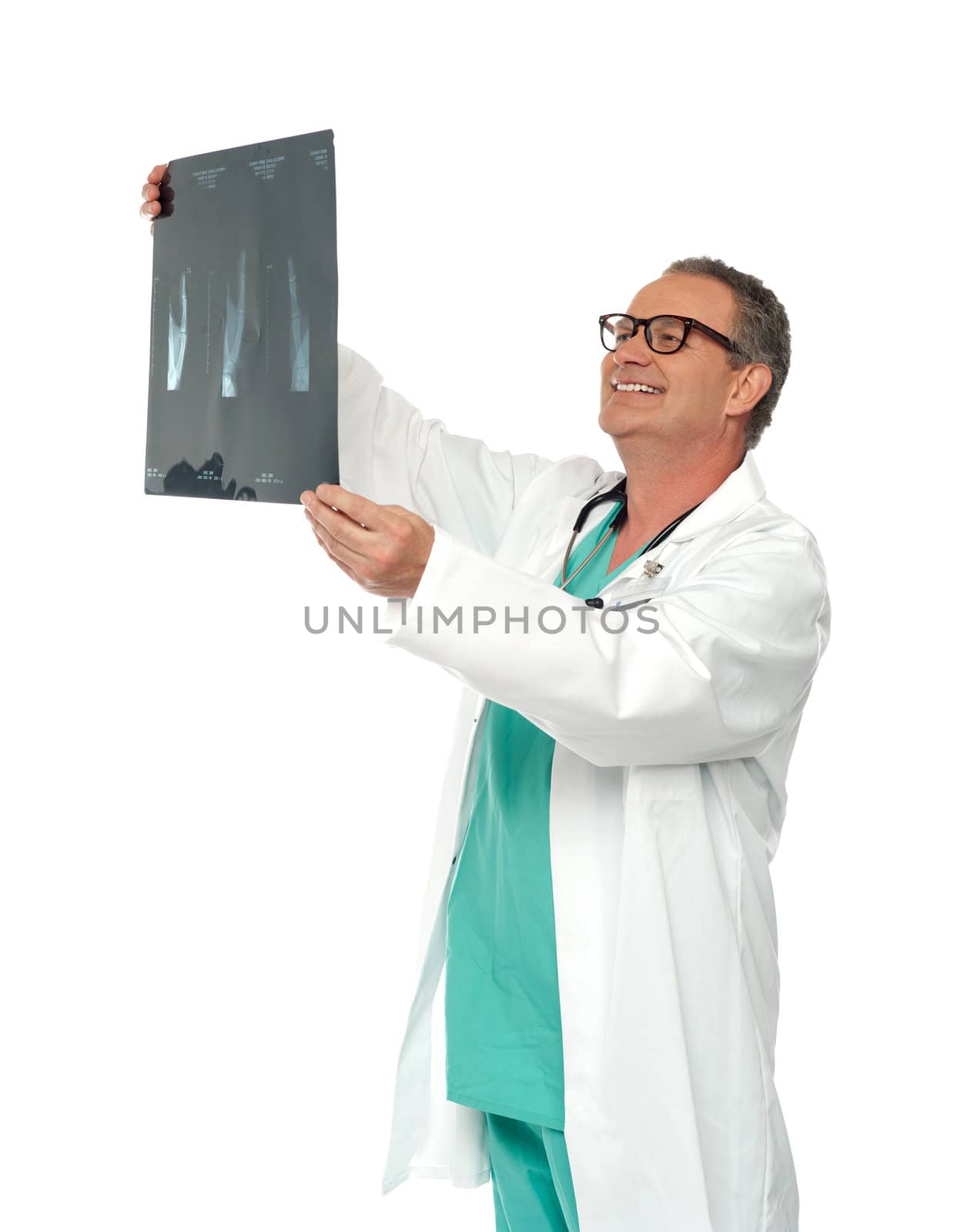 Experienced surgeon looking at x-ray report isolated over white background