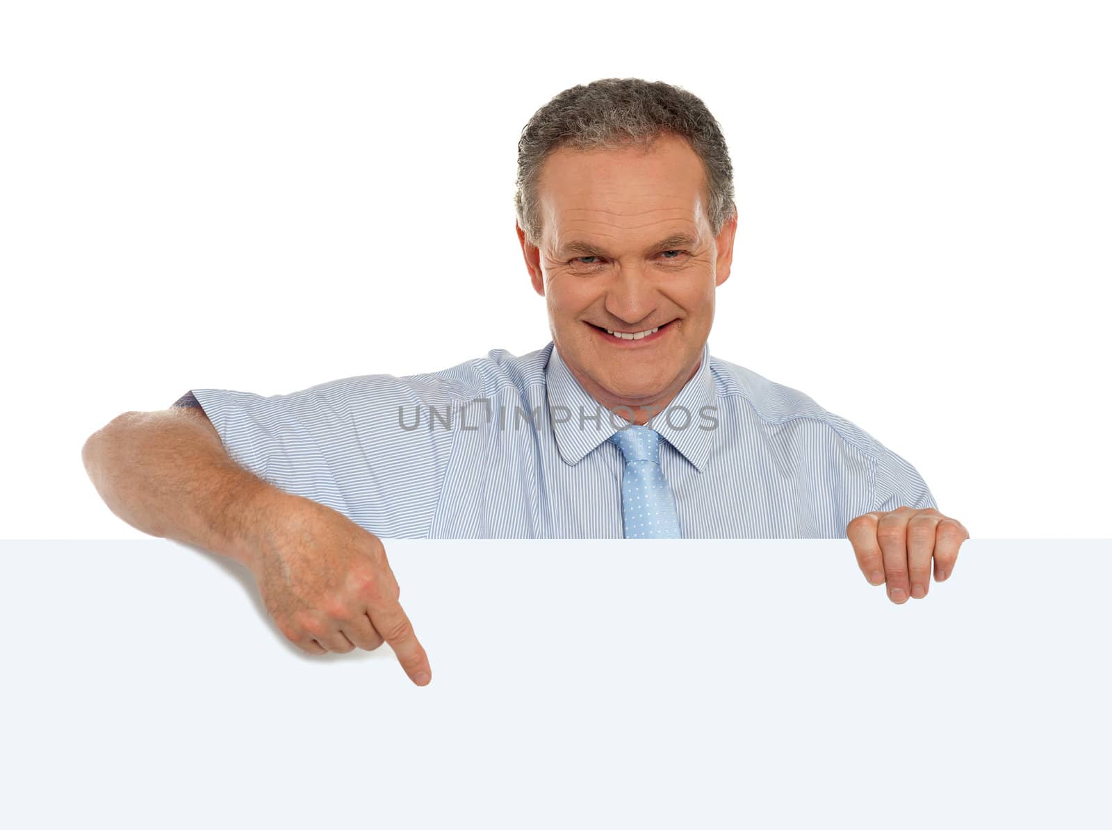 Casual male promoter pointing at blank billboard isolated over white