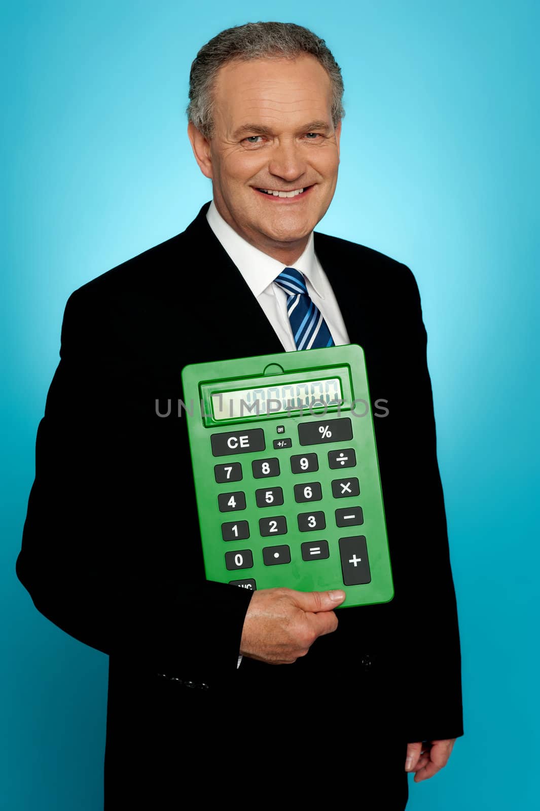 Senior executive posing with big green calculator, showing it to camera
