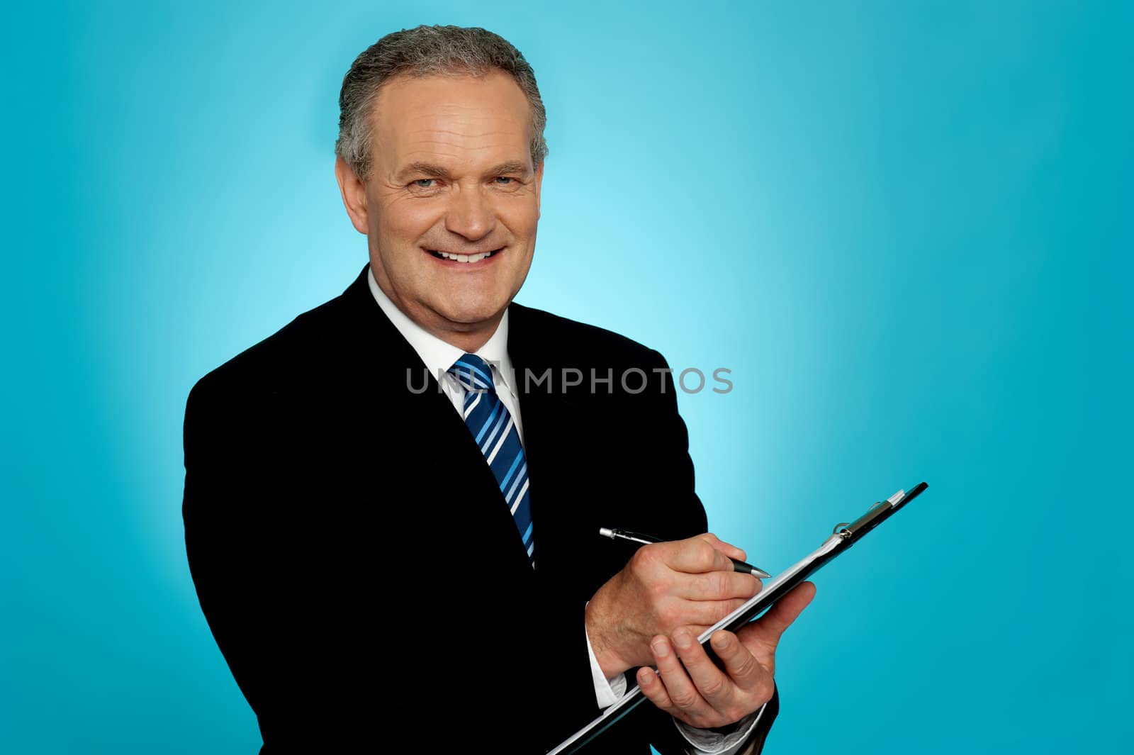 Attractive senior man writing on clipboard. All on gradient blue background