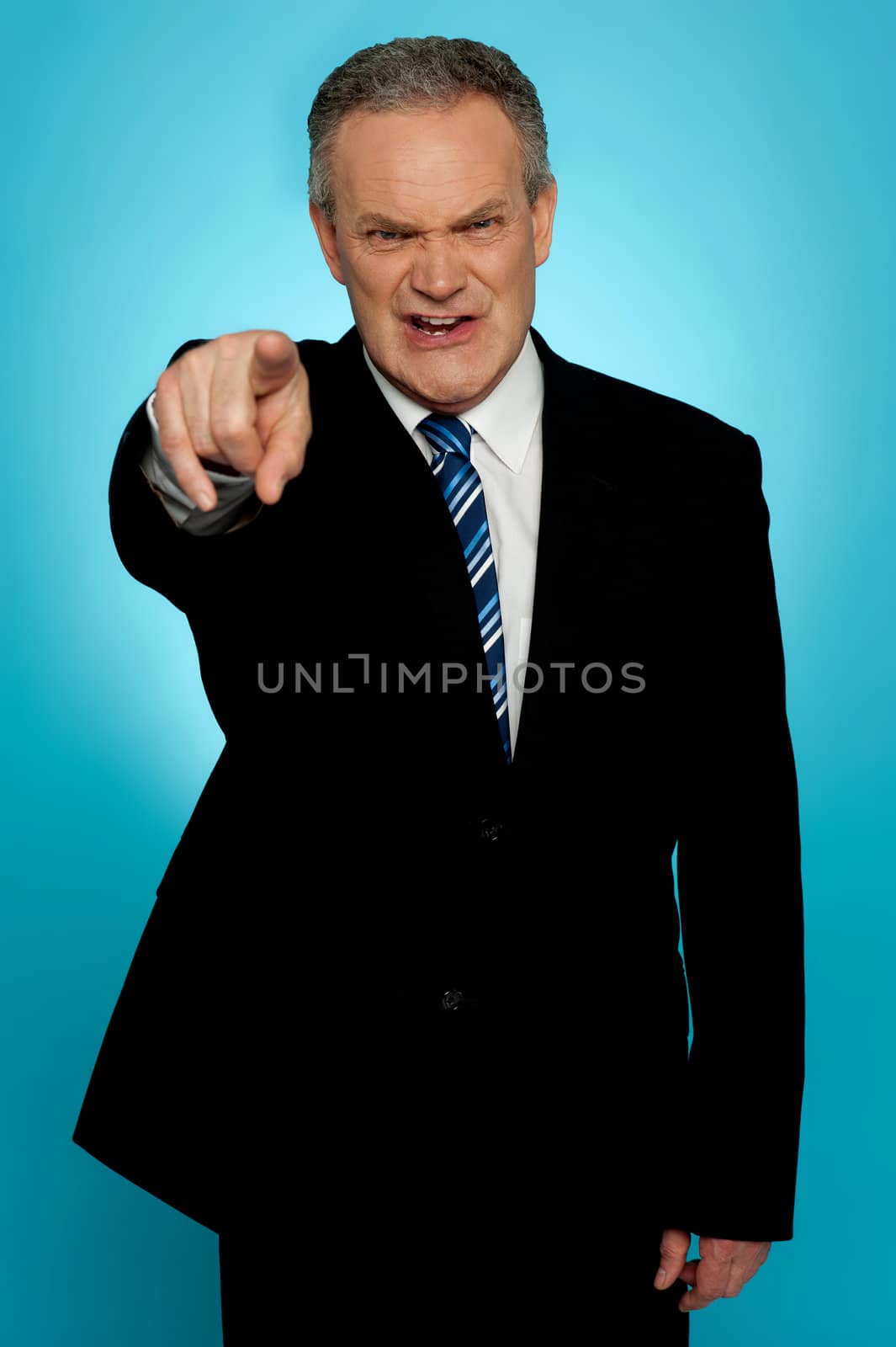 Angry senior businessman pointing finger at you isolated over gradient background