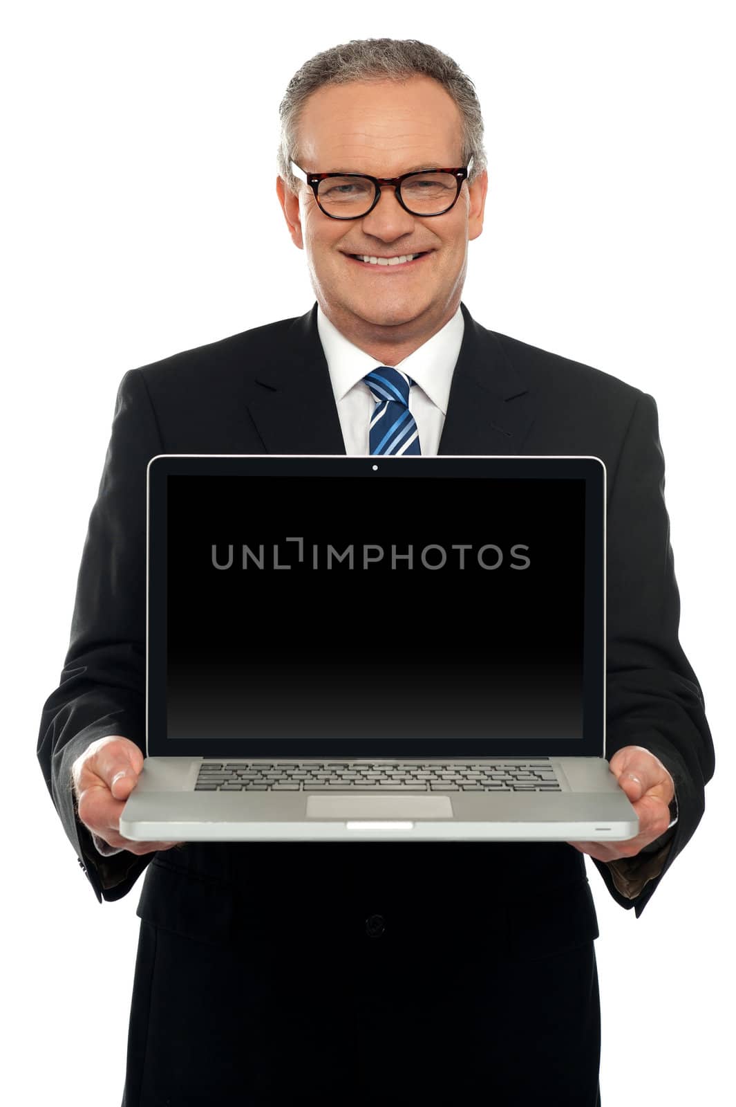 Senior executive standing with open laptop isolated against white background