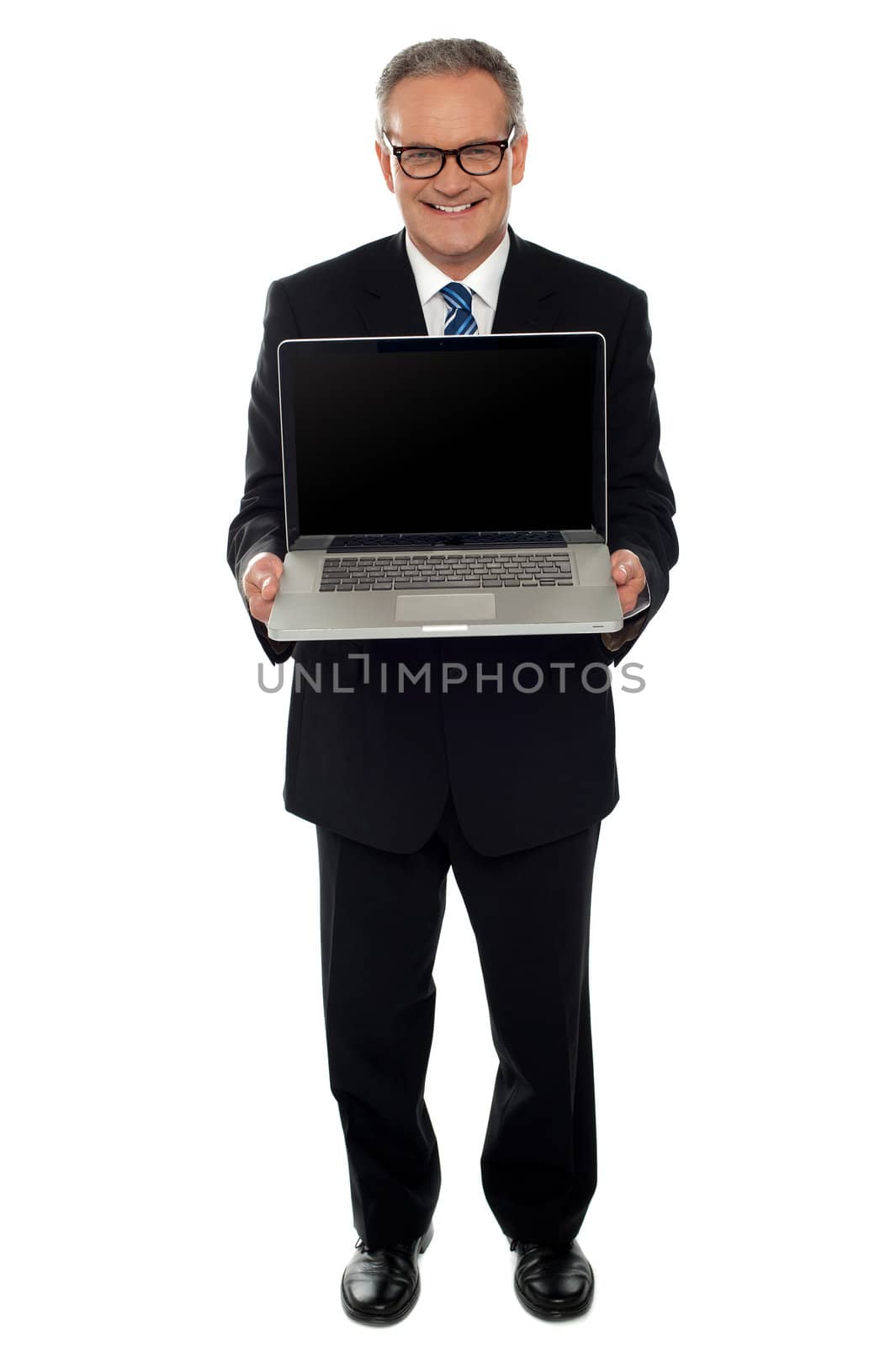 Aged businessman showing newly launched laptop, full length shot