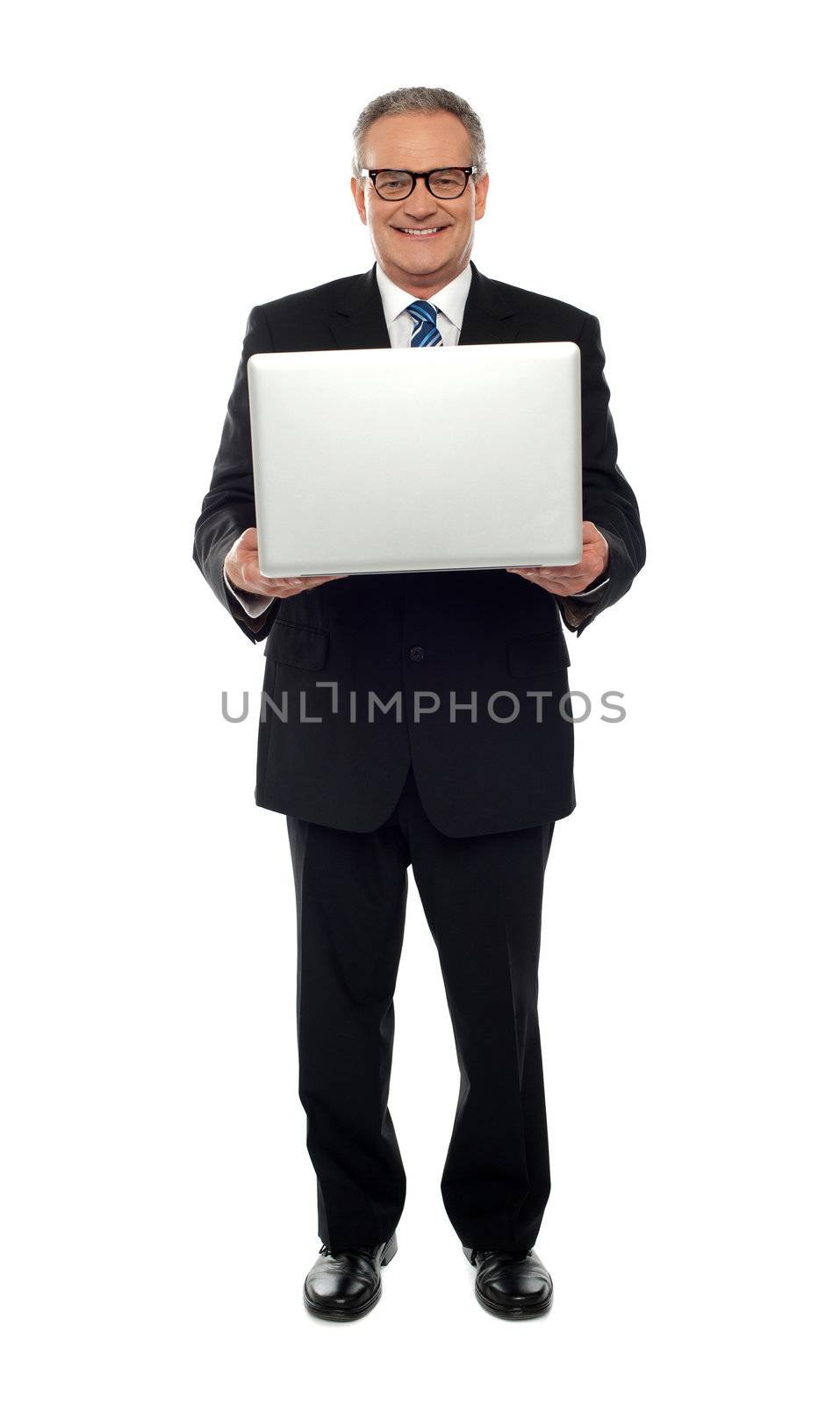 Full length portrait of experienced business person holding laptop
