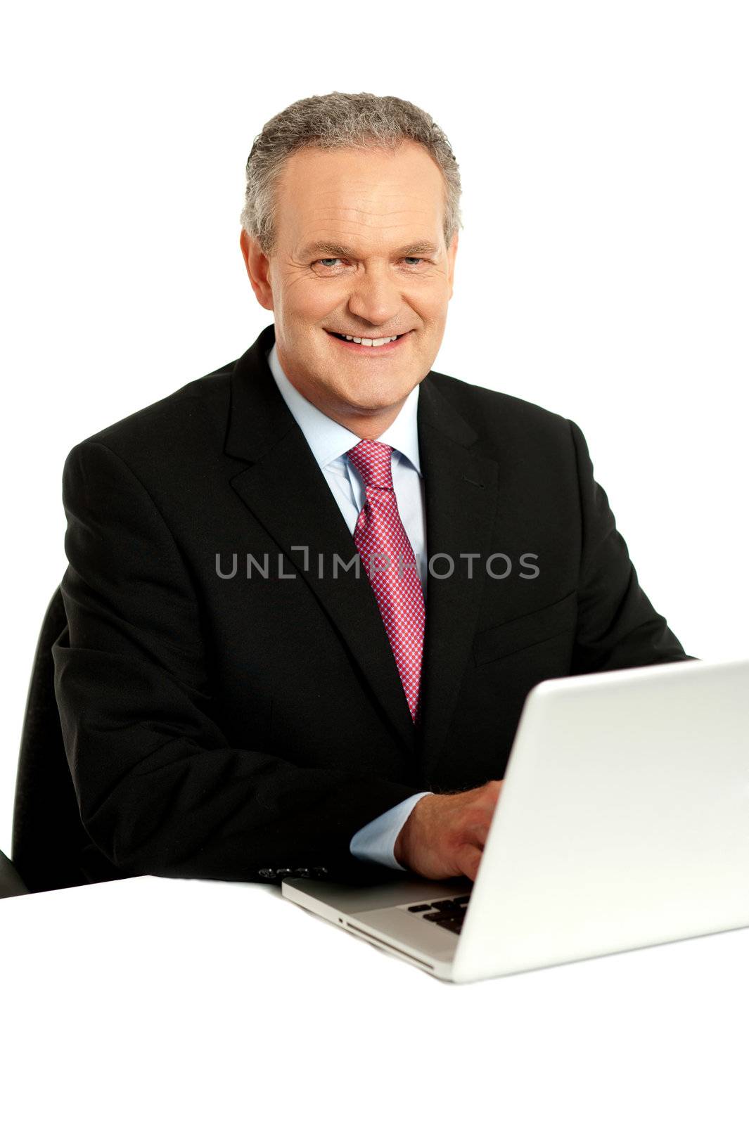 Confident businessman working on laptop isolated over white background