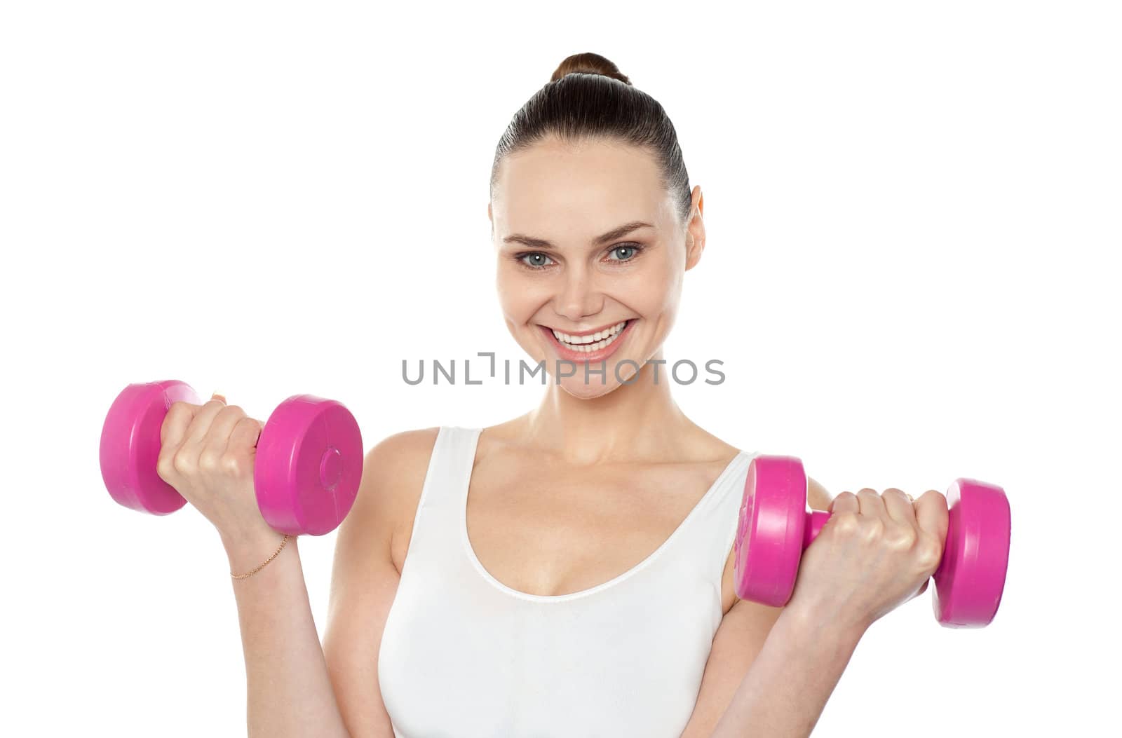 Attractive athlete exercising with dumbbells isolated against white