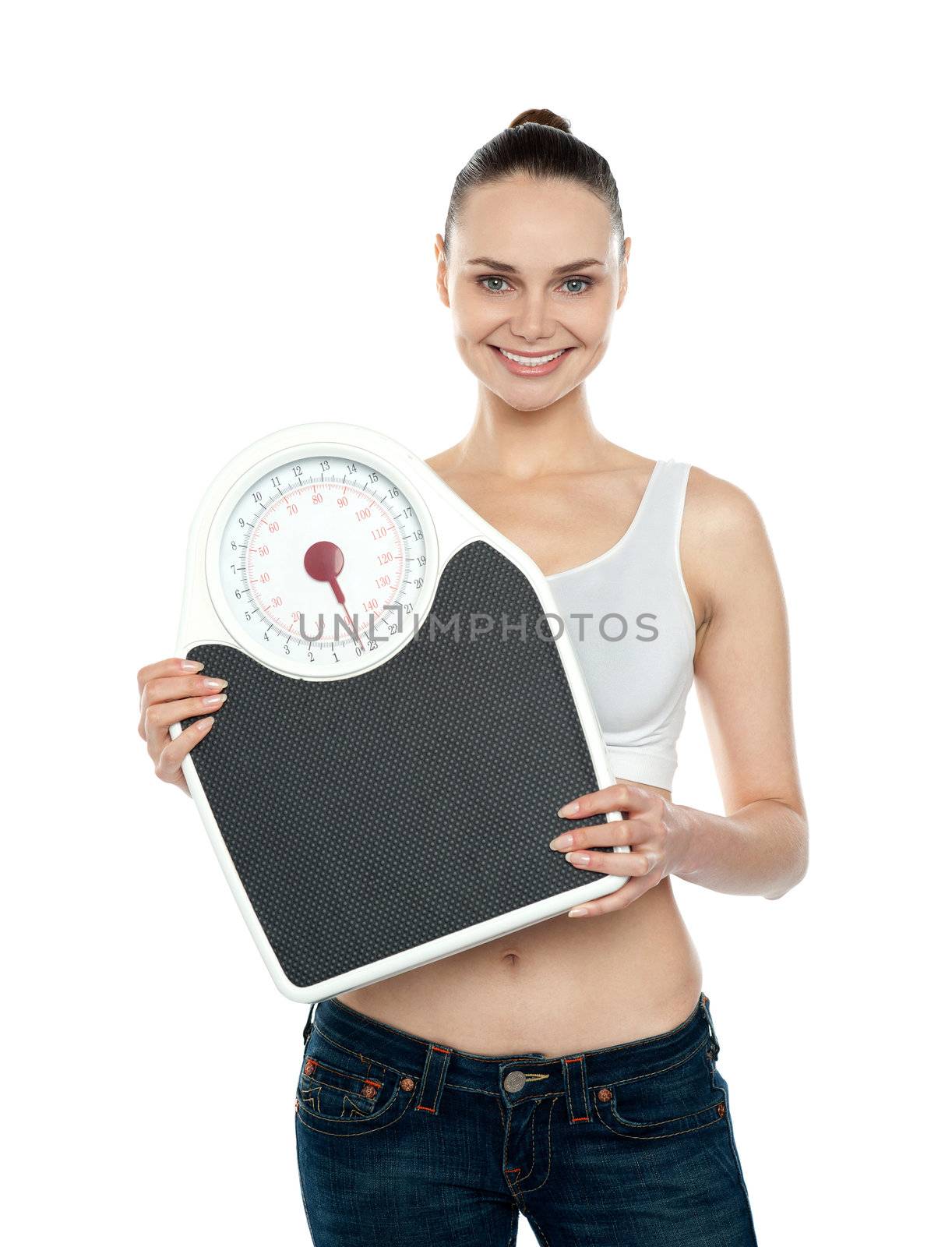 Healthy young woman with a weighing scale isolated over white background