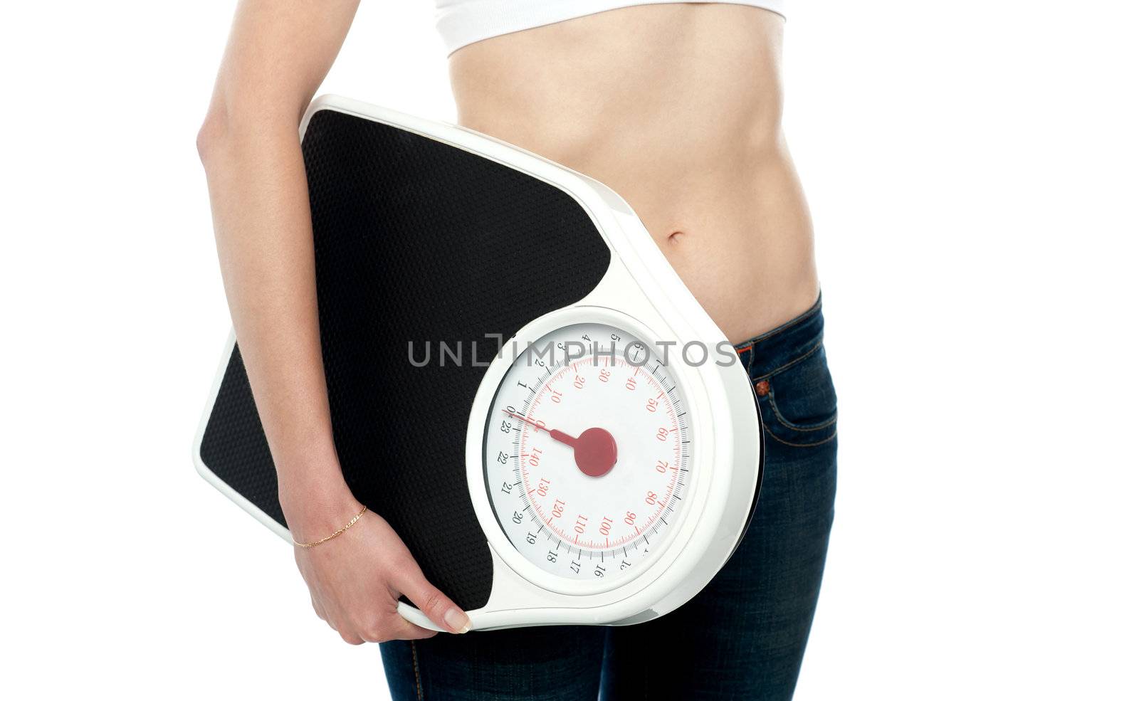 Closeup shot, woman carrying weighing machine. Cropped image