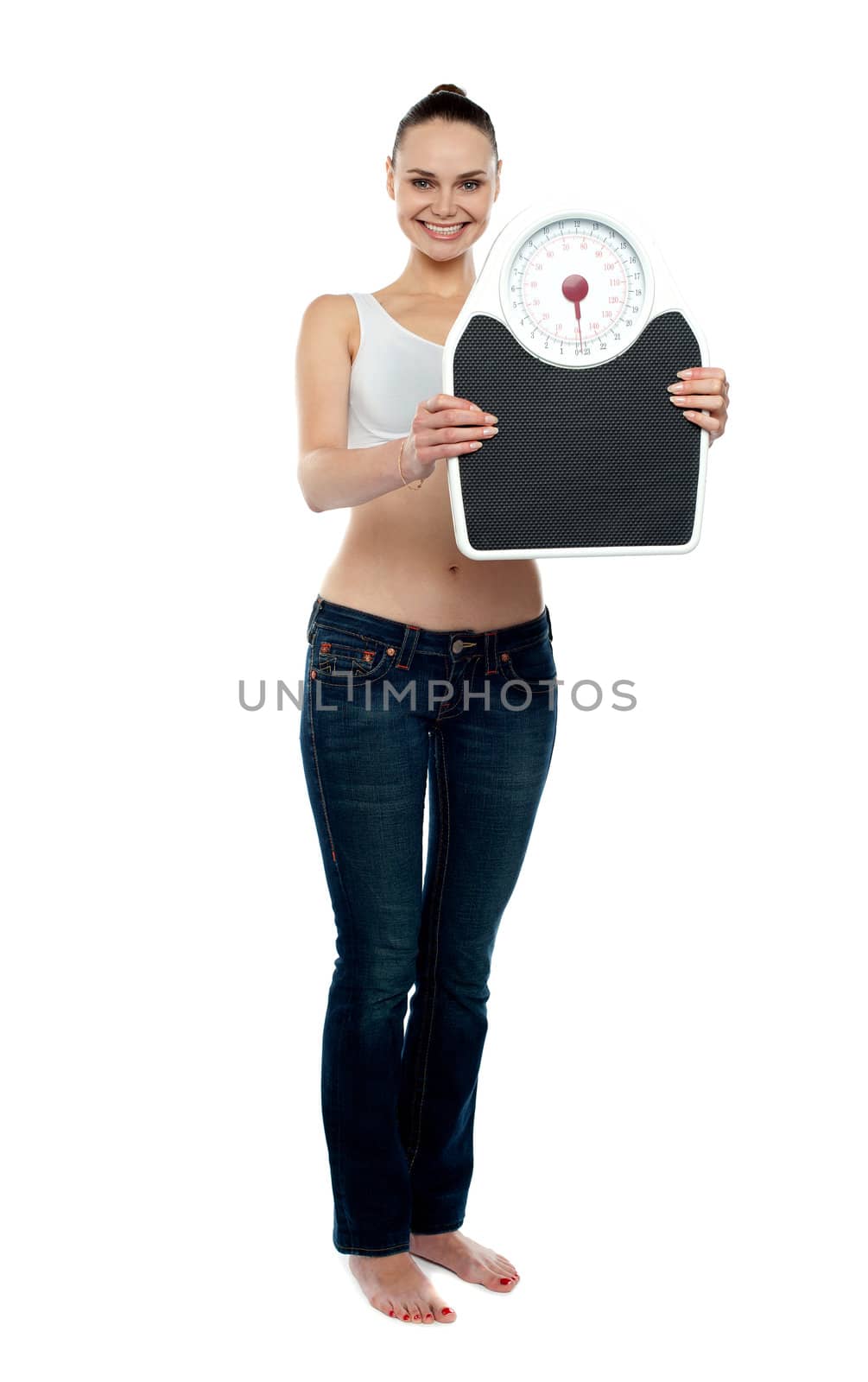 Full frame woman holding a scale against white background