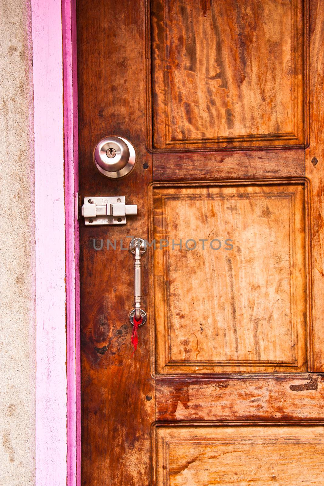 The wooden doors have knobs and handles.