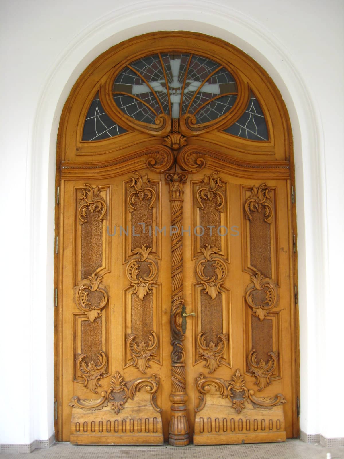 Beautiful wooden gate in Catholic church with patterns