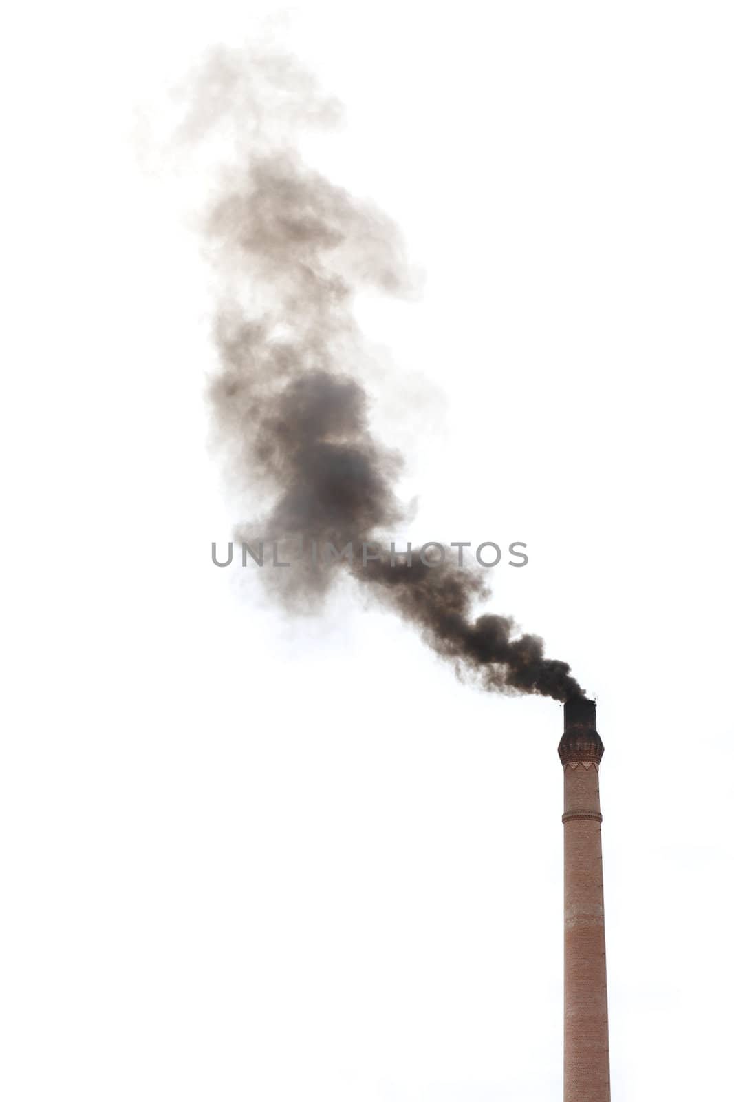 Smoke from smokestack of a traditional rice mill