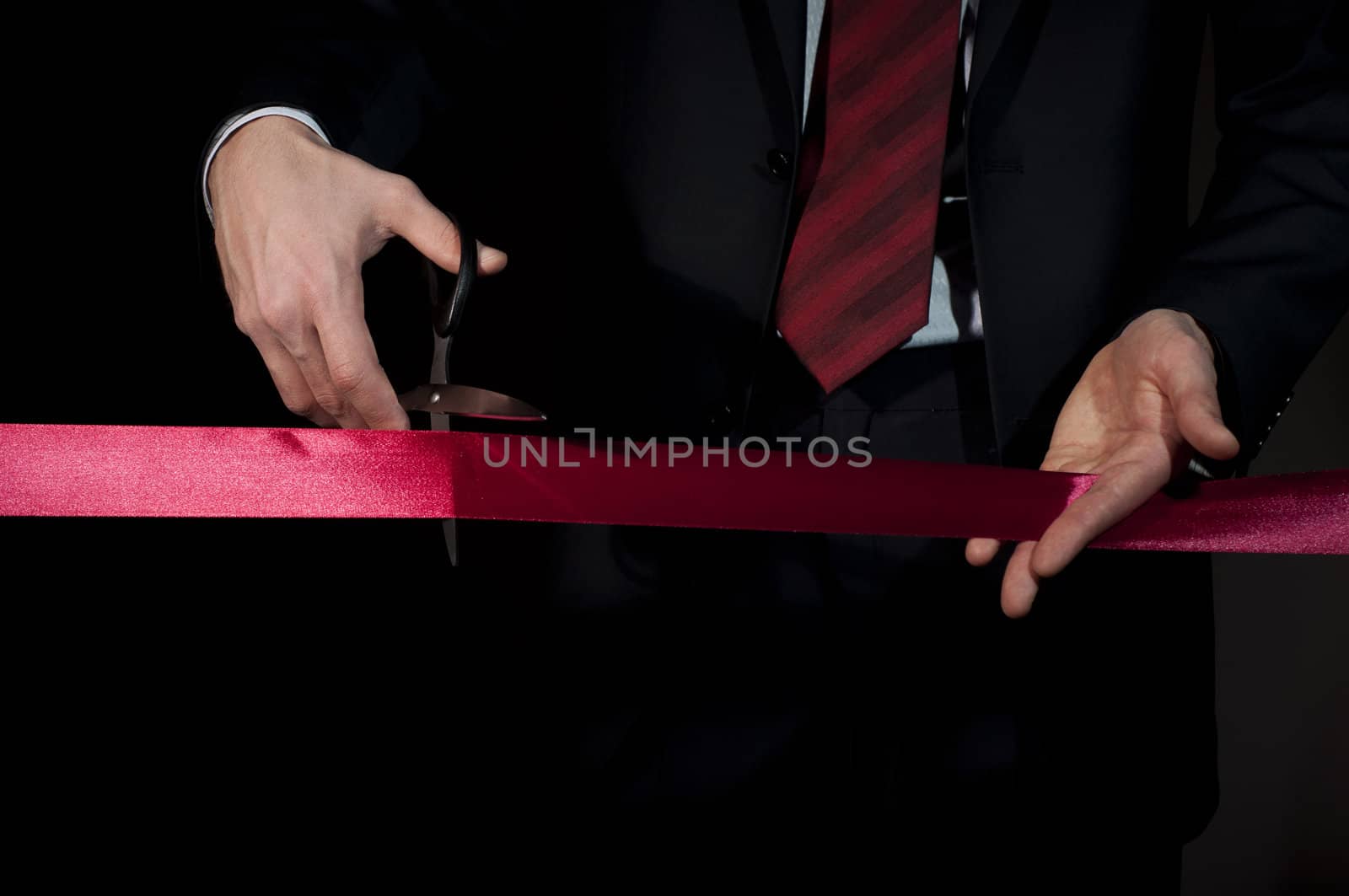 man in a business suit, cut red tape by adam121