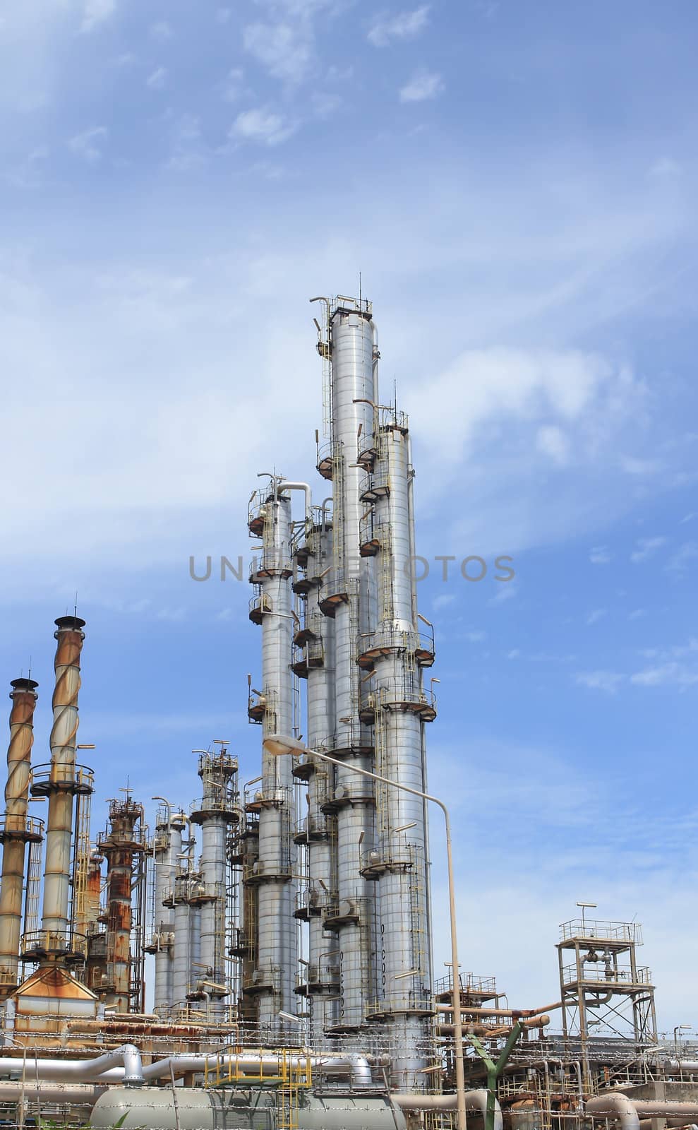 Oil and Gas Refinery Plant with distillation column and tank by rufous