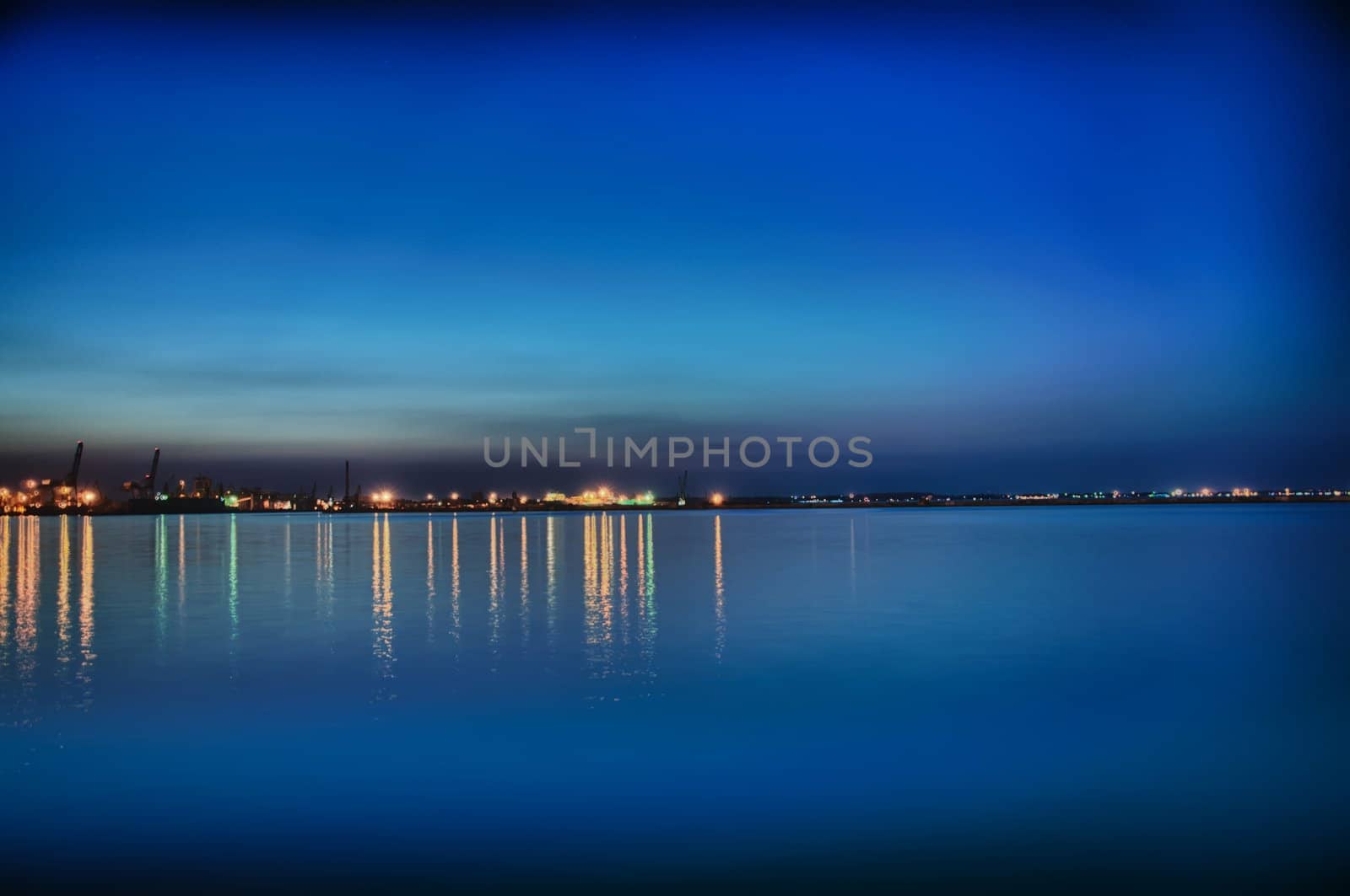 Night coastline, view from the pier of Odessa Sea Port. Ukraine.