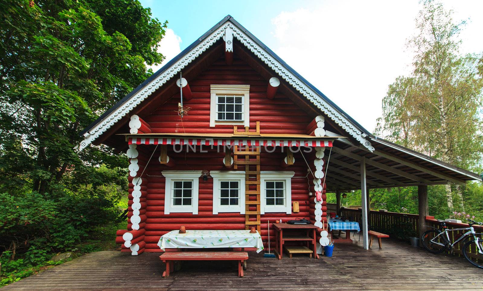 Red Log Cabin n the Forest by Discovod