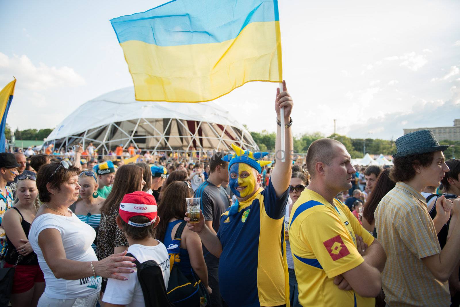 KHARKIV, UKRAINE - JUNE 08: Ukrainian football fan with a Ukrainian flag during football match Netherlands vs Denmark, June 08, 2012 in Kharkov, Ukraine