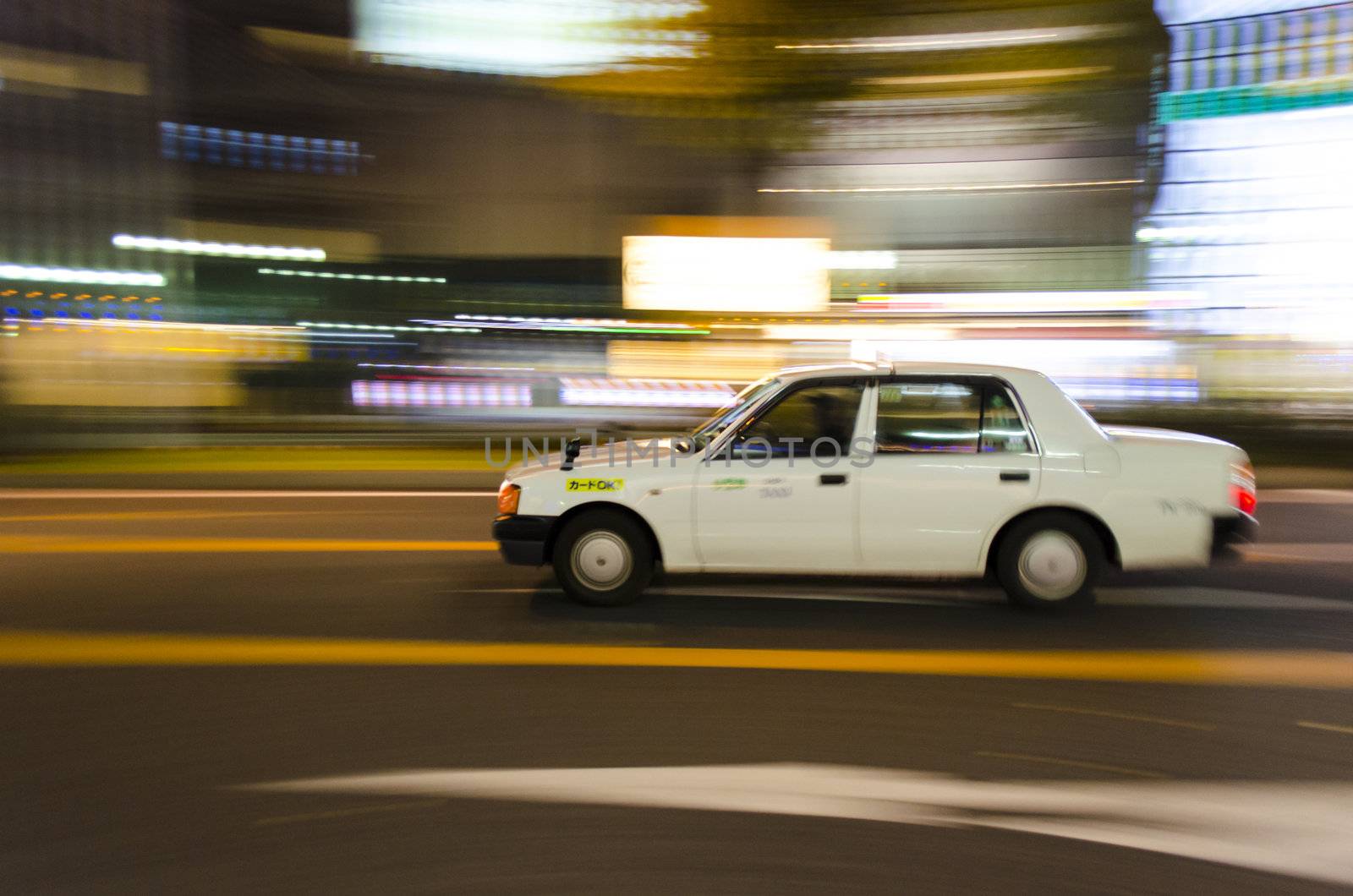 a panning view of a fast taxi in japan nagoya city