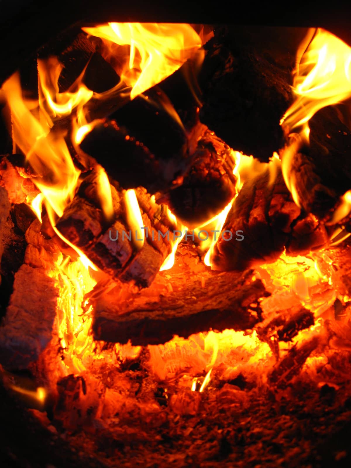 Fire wood brighly burning in the furnace