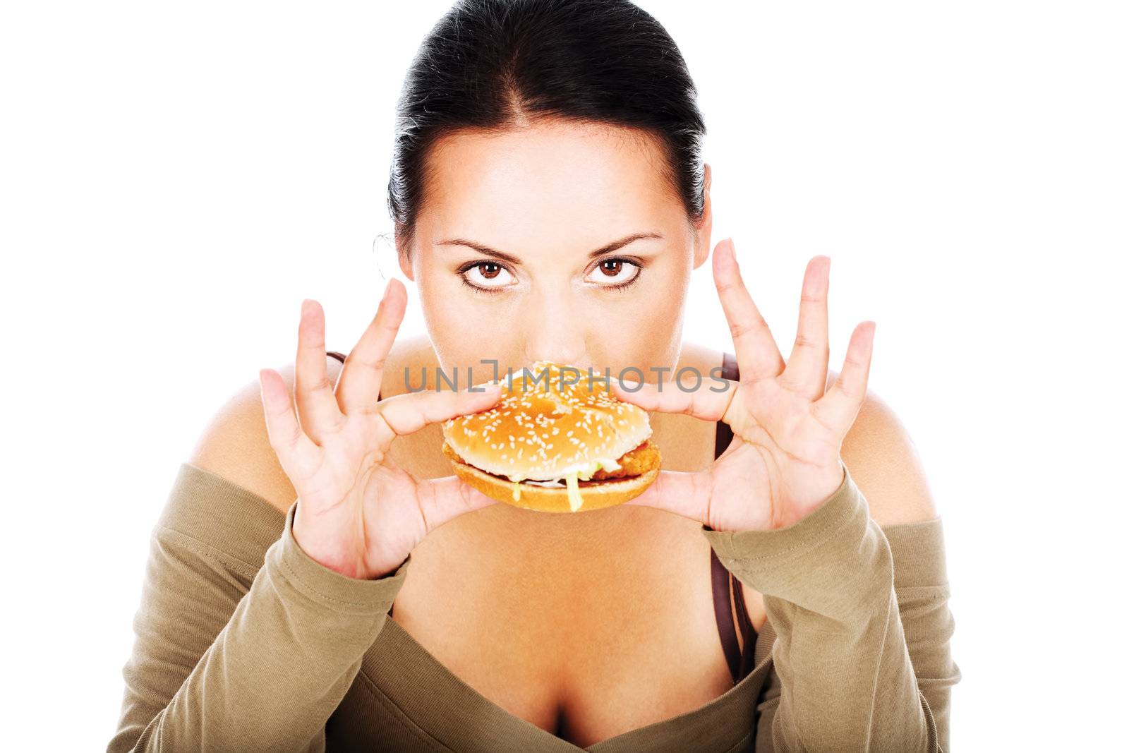 Cute chubby eating a hamburger, isolated on white