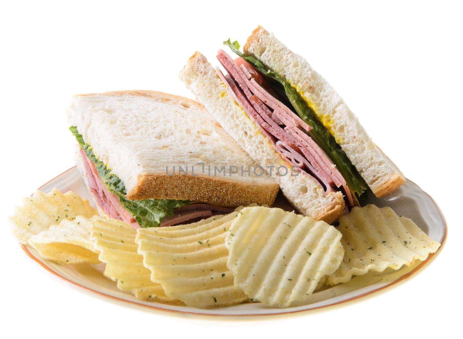 Bologna sandwich with potato chips, isolated on a white background.