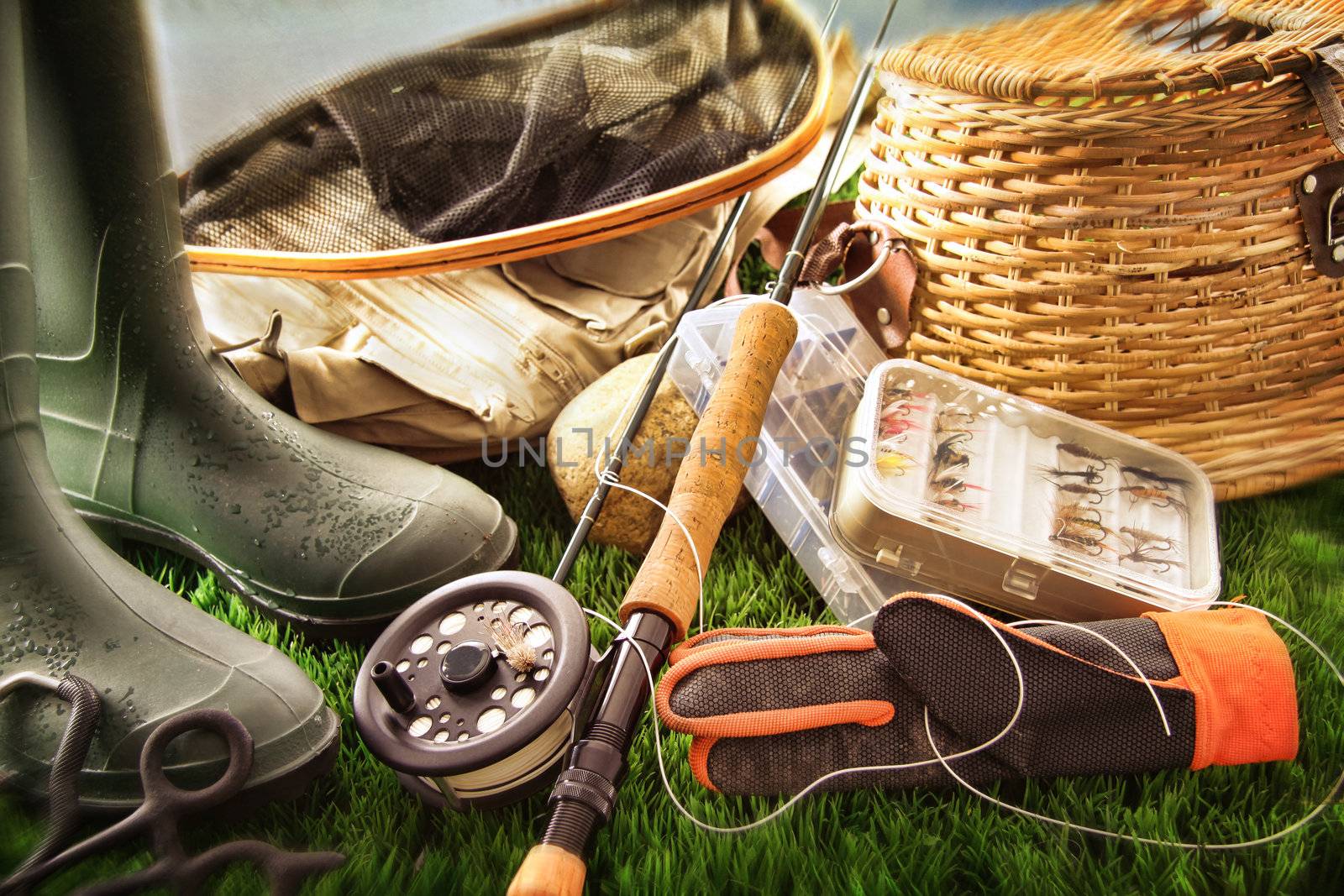 Fly fishing equipment on grass by Sandralise