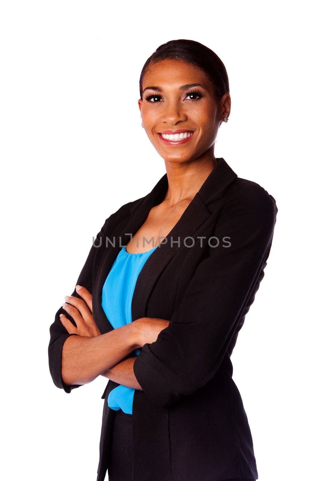 Beautiful happy smiling African executive business woman in suit and arms crossed, isolated.