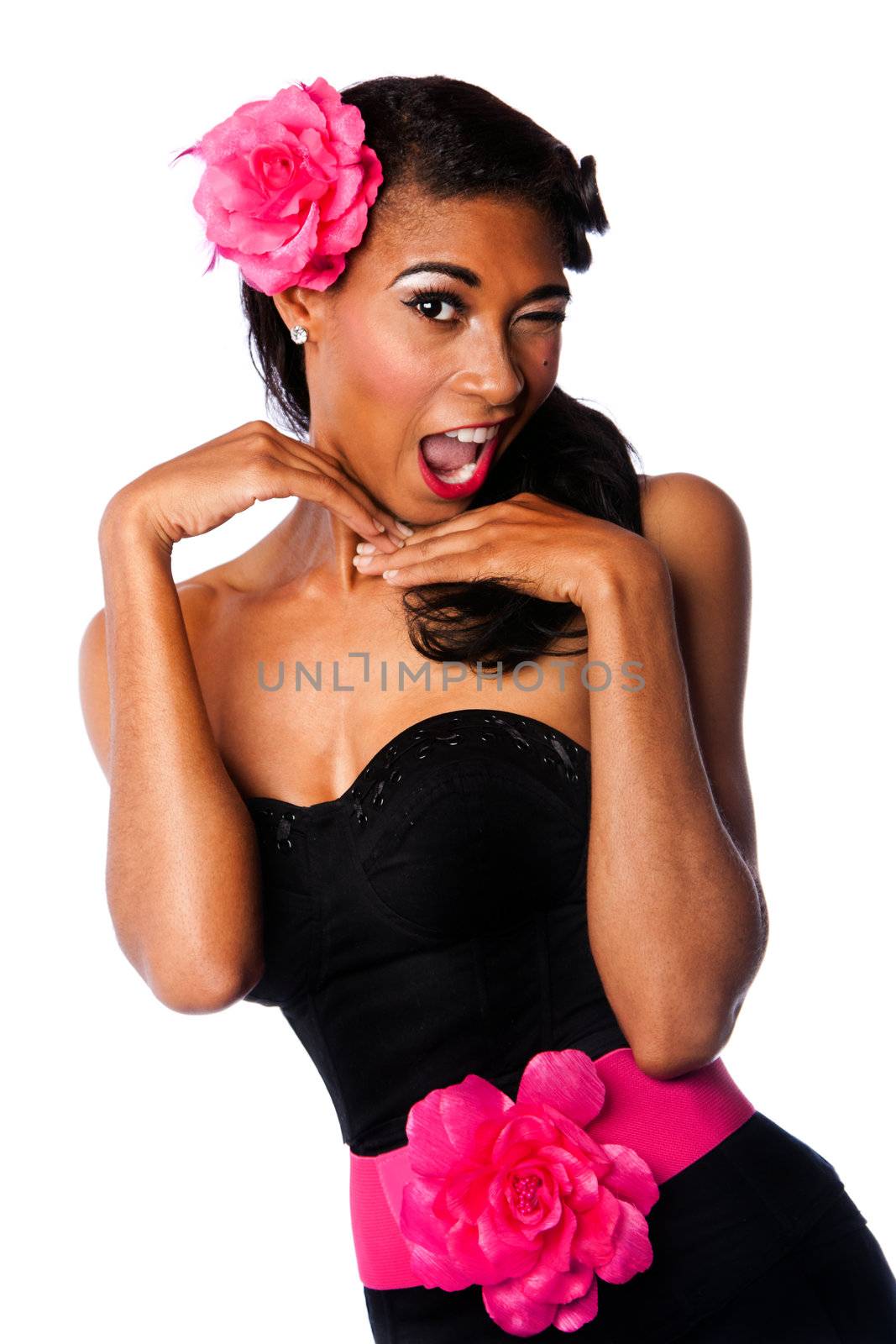 Beautiful pinup girl with pink flowers and black corset winking playfully, isolated.