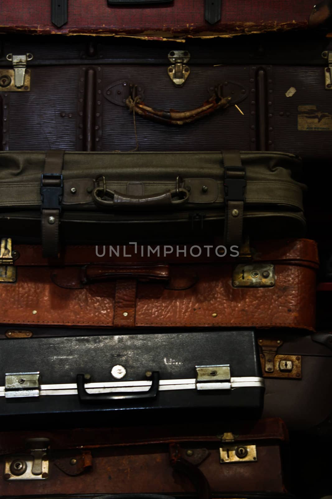 Pile of old vintage suitcases by cameracantabile