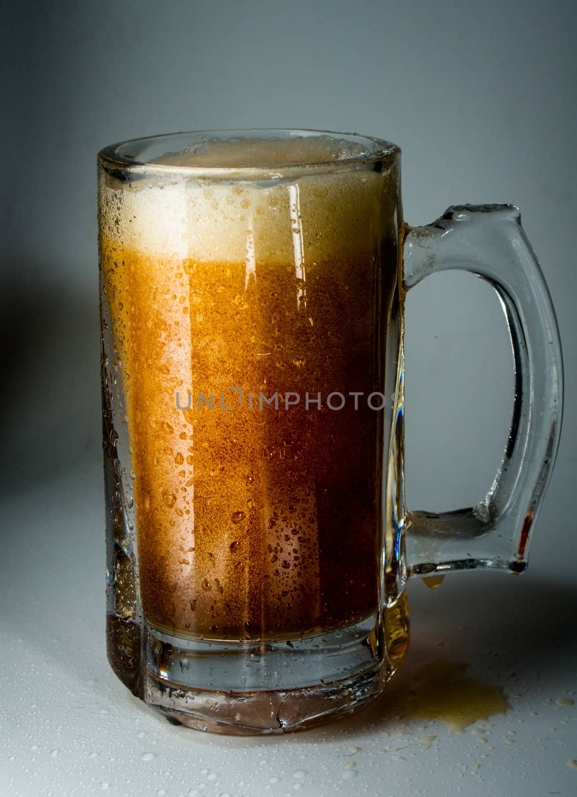 Beer glass full of cold dark beer. Isolated